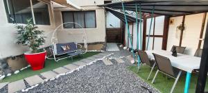 a patio of a house with a table and chairs at Vila Zeus in Cristian
