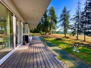 a porch of a house with a view of a field at ORNI House in Hazlov
