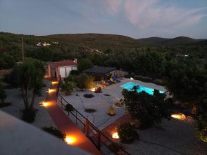 an overhead view of a resort with a swimming pool at night at B&B Casa Flamenga in Alte