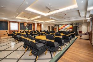 a conference room with a table and chairs at Trayee International in Digha +164 photos