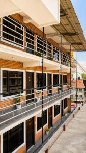 a building with balconies on the side of it at Boudha Mandala Hotel in Kathmandu