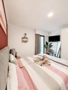 a bedroom with a bed with a blanket on it at Villa Bavaria B in Ponta do Sol +19 photos