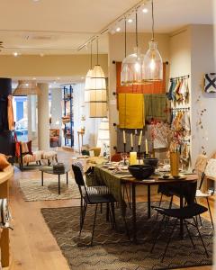 a living room with a dining table and chairs at Beausejour Ranelagh in Paris
