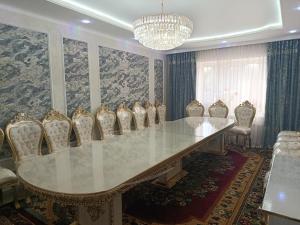 a conference room with a long table and chairs at Bayel Guest house in Kochkorka