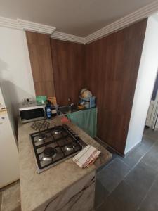 a kitchen with a stove and a counter top at Maison Kram Plage in Le Kram +10 photos