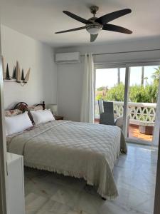 a bedroom with a bed and a ceiling fan at Casa Costa del Sol Beach&Golf,Marbella in Sitio de Calahonda