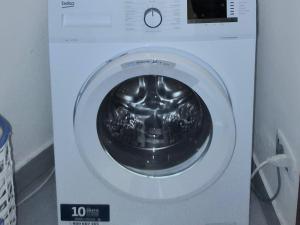 a washing machine is shown with its door open at Leoncorno la Marina a Villasimius in Villasimius
