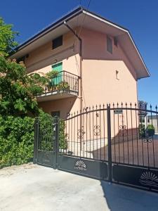 a black gate in front of a house at Tra mare e vigneti in Ortona
