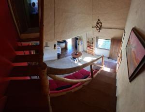 an overhead view of a living room and a staircase in a house at Chalé Jardim Mágico in Milho Verde