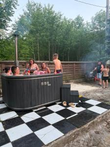 a group of people sitting in a hot tub at Hotel palas tatarıv in Tatariv