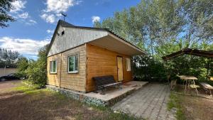 a small house with a bench in front of it at Voyage in Sevan
