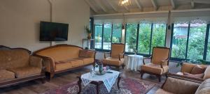 a living room with couches and a table at Ömer bey konak in Akcaabat