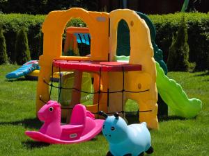a play set with two toy animals on the grass at Arcada in Jarosławiec