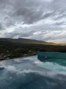 a swimming pool with a view of a mountain at Wonderland Resort Chiangmai in Chiang Mai