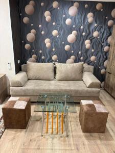a living room with a couch and a table at Kapan Guesthouse in Kapan +3 photos