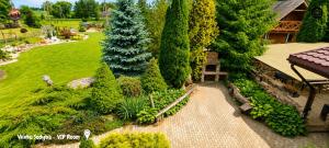 an overhead view of a garden with trees and a house at Vilimu Sodyba - VIP Room in Kriukai