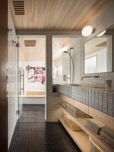 a bathroom with a sink and a mirror at Trunk House in Tokyo