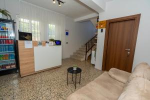 a living room with a couch and a table at Hotel Aleks in Shkodër
