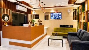 a lobby with a bar and a couch at Hotel MountView Comforts in Tirupati