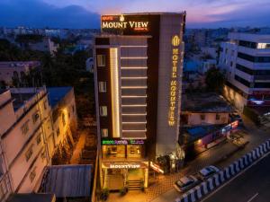 a night view of a hotel in a city at Hotel MountView Comforts in Tirupati