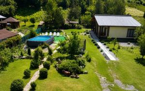 an aerial view of a garden with a swimming pool at Подих Карпат in Slavske