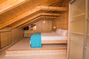 a bedroom in a log cabin with a bed at Grand Boutique in Vasiliki +90 photos