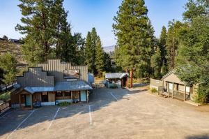 an aerial view of a house with a parking lot at River Pines Inn in Winthrop