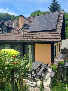 a house with solar panels on the roof at Das Altsteirische Landhaus - La Maison de Pronegg - Feriendomizil im Biosphärenpark Wienerwald in Pressbaum +22 photos