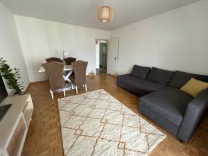 a living room with a couch and a table at Apartment in Stäfa in Stäfa
