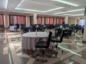 a conference room with a table and chairs at Kampala Nile Resort in Seeta +80 photos