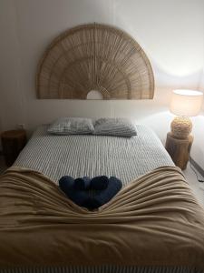 a bed with a blue bowl on top of it at Eleven Castelo in Mértola +35 photos