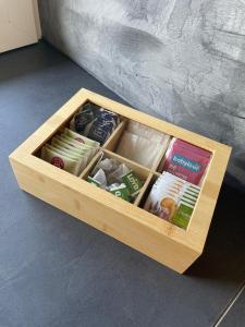 a wooden crate filled with different types of food at Apartmány Branná hodnocení 10 Wellness Vleky 5 min in Horní Branná