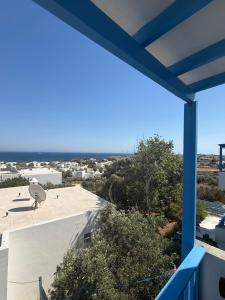 a view of the ocean from the balcony of a house at Studios Panorama Drios in Drios