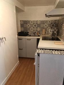 a kitchen with a sink and a counter top at Gîte du piémont in Mouzon +11 photos