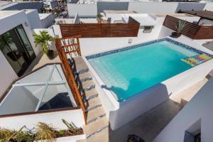 an aerial view of a house with a swimming pool at Paraíso maya apartaments in Playa del Carmen