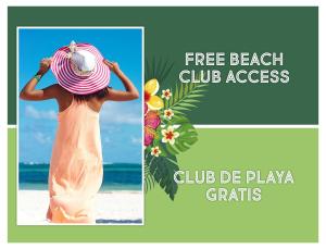 a woman wearing a straw hat on the beach at FIESTA LOS CORALES - VILLAS and SUITES in Punta Cana