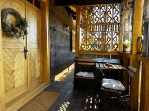 an entrance to a building with a wooden door at Čardak Mraclin in Mraclin
