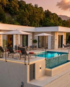 a villa with a swimming pool and a house at Alta Vista House in Bar