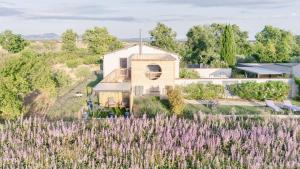 an aerial view of a house with a field of lavender at Le Spa des lavandes panoramique in Valensole