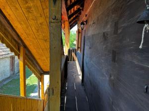 an empty hallway of a house with a wooden ceiling at Čardak Mraclin in Mraclin
