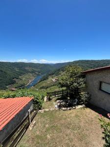 a house with a view of a river at Mirar&Soñar in Chantada