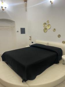 Llit o llits en una habitació de Himeros Suite