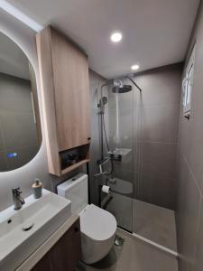a bathroom with a shower and a toilet and a sink at Blue Yard in Lepetani +18 photos