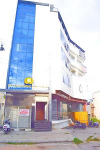 a building with motorcycles parked in front of it at Sri Darshini Comfort Hinkal Mysore in Vānivilāsa Puram