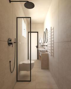 a bathroom with a shower and a toilet and a sink at Haus Platanos Apartments & Bungalows by the Sea in Vourvourou +94 photos