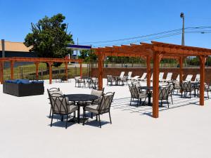 a patio with tables and chairs and a pavilion at Quality Inn Harrodsburg in Harrodsburg