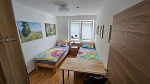 a small room with two beds and a table at Wohnung in Datteln in Datteln +57 photos