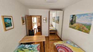 a living room with a table and a bedroom at Wohnung in Datteln in Datteln