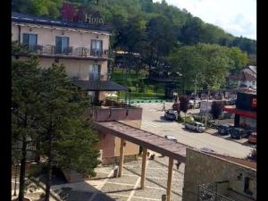 a view of a building and a parking lot at Vivo in Jagodina +4 photos