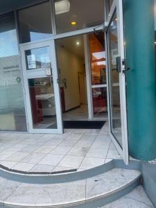 an entrance to a building with sliding glass doors at Hobart city hotel in Hobart